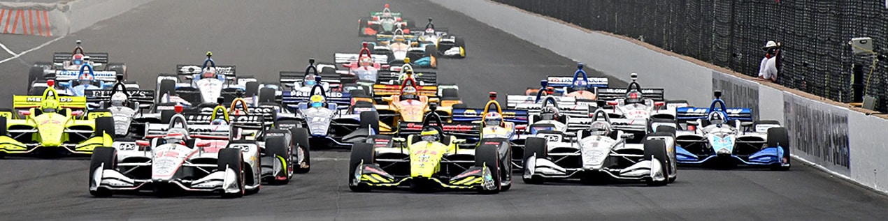indy cars racing to through the start line Ames