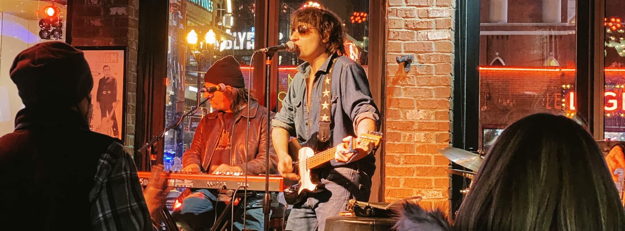 bar singer on guitar in Ames